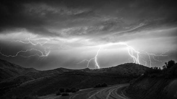 thunderstorm over countryside hills