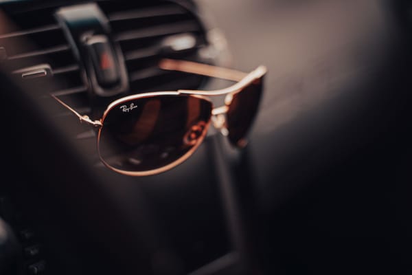 ray ban sunglasses on a car vent
